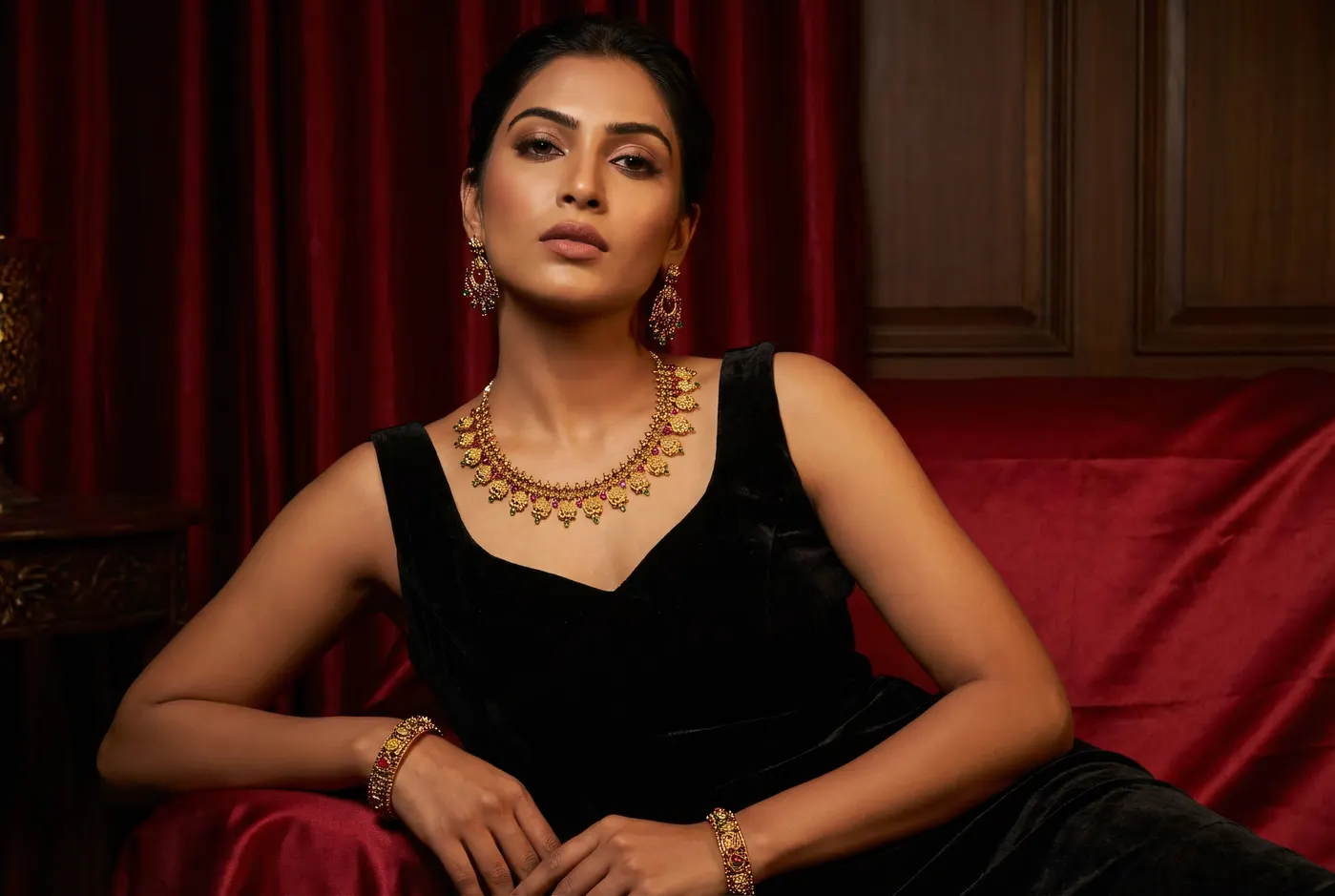 Young model in editorial portrait with Palakka Mala ruby and green necklace