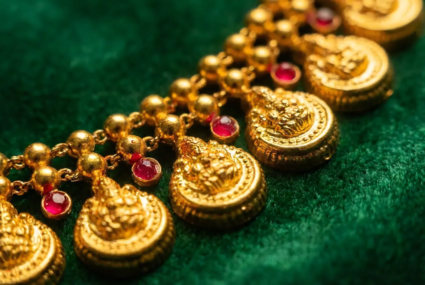 Kasu Mala coin necklace with rubies on emerald velvet