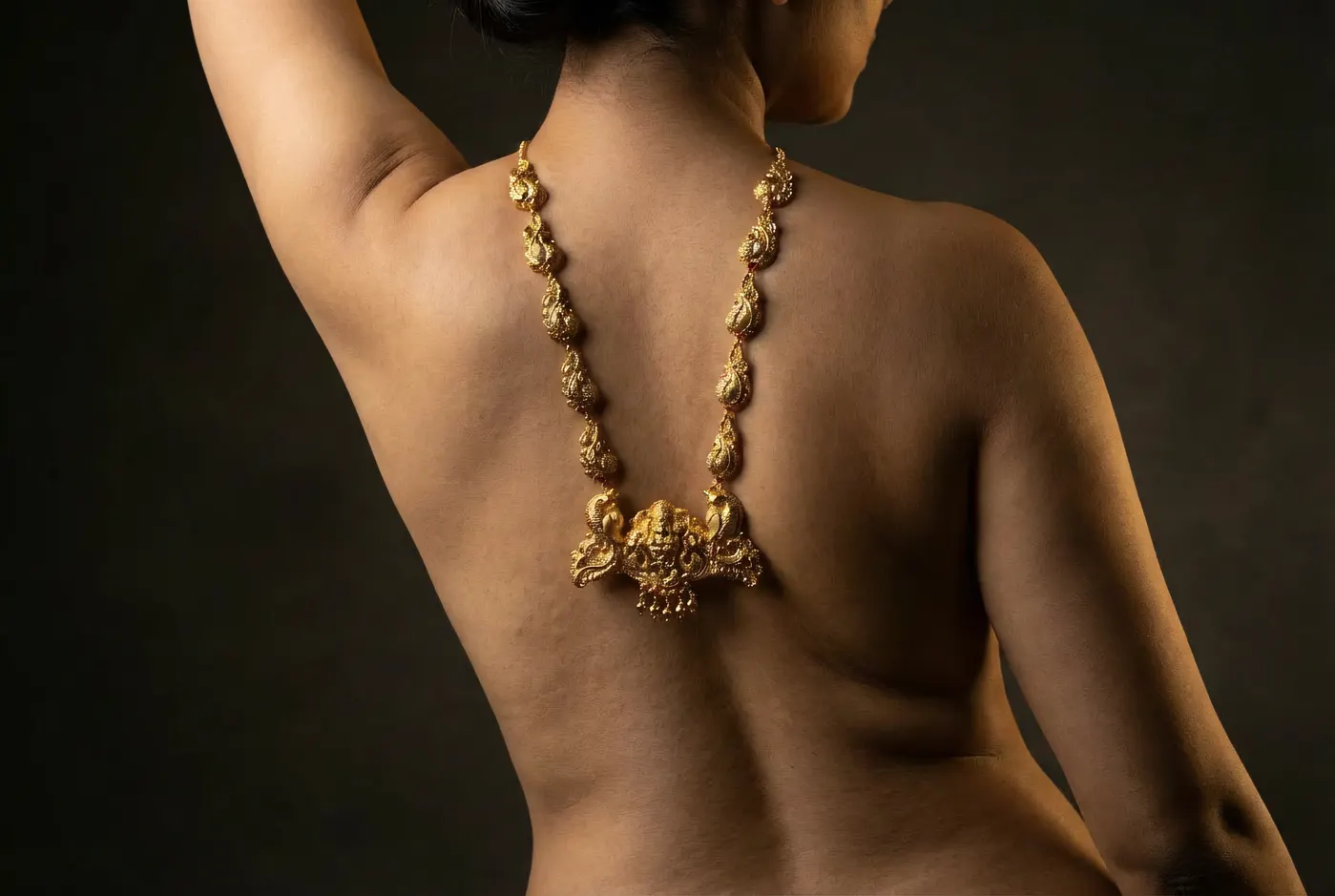 High angle portrait, dynamic pose with Manga Mala temple gold