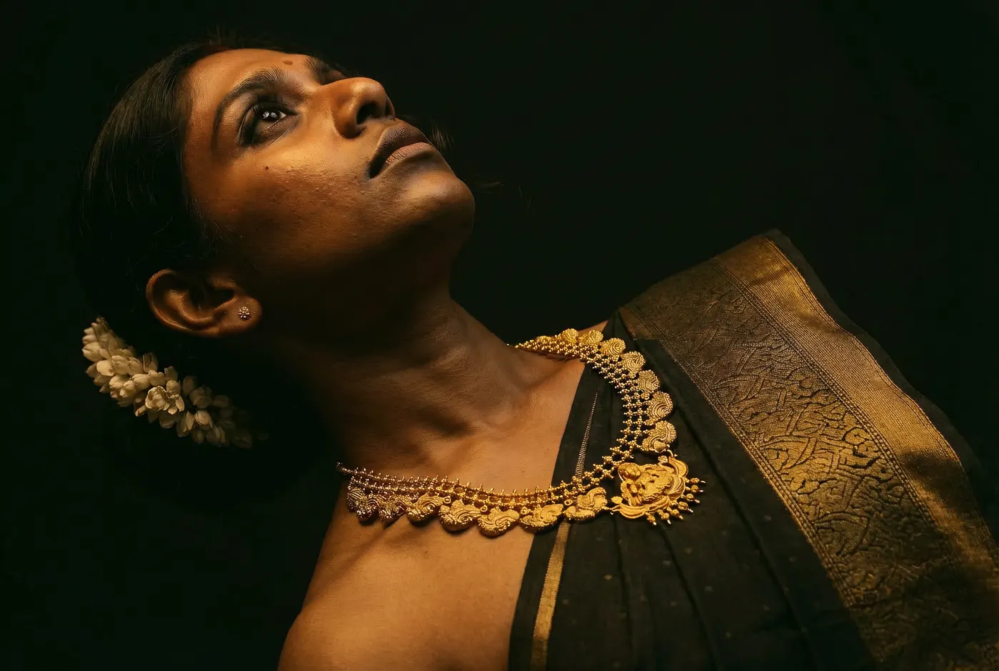Low angle portrait wearing Kasu Mala coin necklace